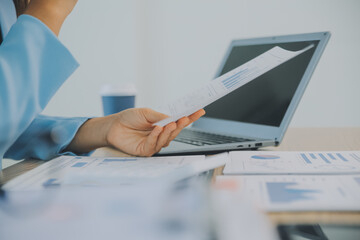 Business team working with new startup project plan and discussion information for financial strategy with laptop and digital tablet in a modern business lounge.