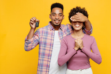 Young smiling couple two friend family man woman of African American ethnicity wear purple casual...