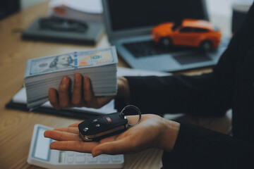 Salesman send key to customer after good deal agreement, successful car loan contract buying or selling new vehicle.