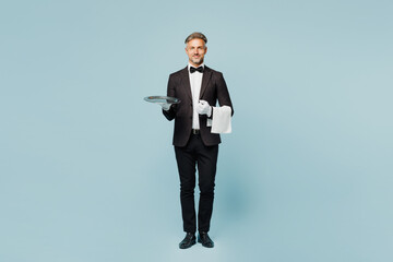 Full body adult barista male waiter butler man wearing shirt black suit bow tie elegant uniform...