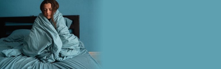 Cozy morning concept. Attractive girl feels warm in her bed, covers self duvet in her bedroom - obrazy, fototapety, plakaty