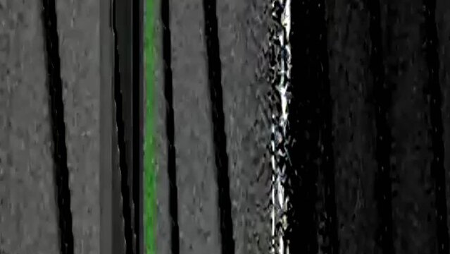 Analog glitch. Noise artifacts. TV switch on off. White green real distortion transition effect on dark black abstract free space background.