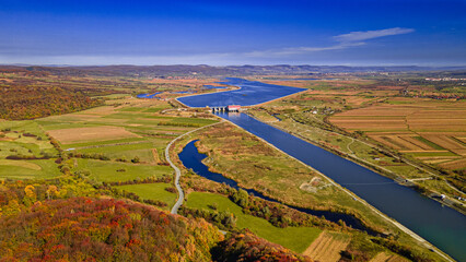 River dam, autumn colours in Romania | drone view