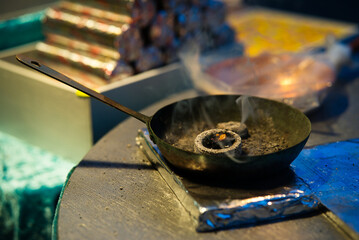 Aromatic Incense Pan on Aluminum Foil with Festive Background