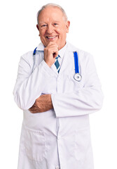 Senior handsome grey-haired man wearing doctor coat and stethoscope looking confident at the camera smiling with crossed arms and hand raised on chin. thinking positive.
