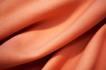 Apricot colour silk wave drapery abstract background. Flowing fabric texture concept