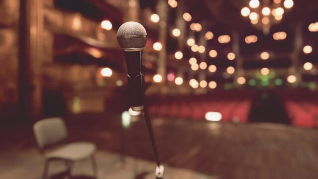 The Serenade's Stage: A Captivating Opera Performance With a Microphone and Chair in the Background