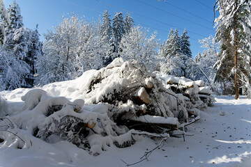 View of a Bavarian winter landscape with lots of snow, blue sky with clouds on a cold winter day