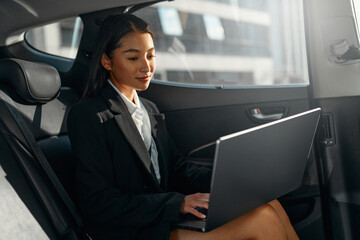 Businesswoman sitting in car