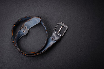 Old leather men's belt with an old-style metal buckle