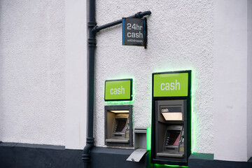 Cash machine in wall outside bank in city centre