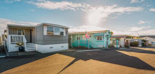 Mobile home park. A row of residential mobile park homes in a small town somewhere in California, street view. Lifestyle, architecture