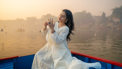 Portrait of a beautiful Indian girl, wearing traditional dress, outdoor nature background © Arnav Pratap Singh