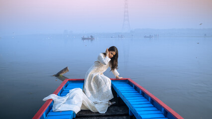 Portrait of a beautiful Indian girl, wearing traditional dress, outdoor nature background