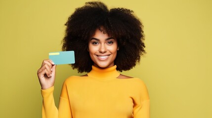 Credit card held by black woman, studio concept shot, colorful background