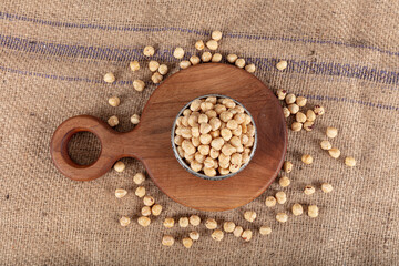 Hazelnut varieties in copper bowl on linen background. Roasted shelled hazelnuts, shelled hazelnuts and shellless roasted hazelnuts. Healthy food concept. Diet foods.