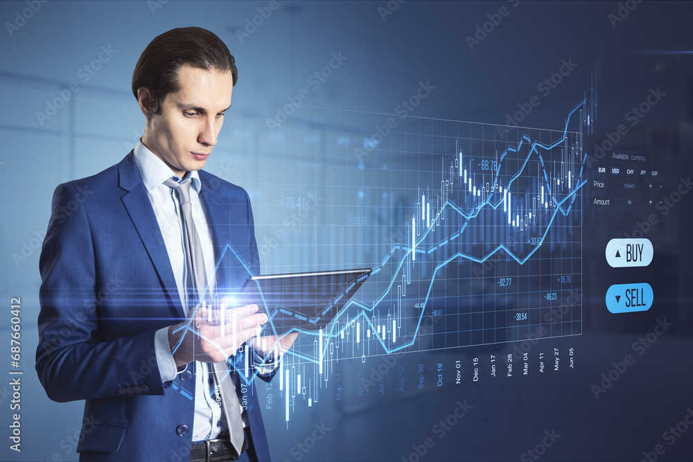 Poster attractive businessman with pad using creative candlestick trading graph on blurry office background