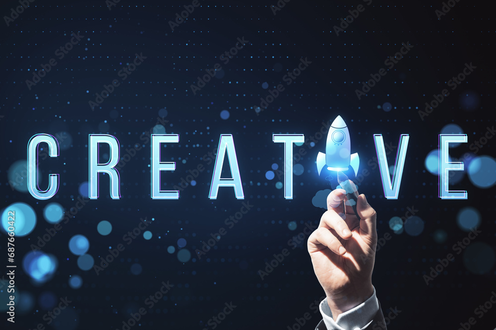 Poster close up of male hand pointing at creative text with space ship replacing letter on blurry backgroun