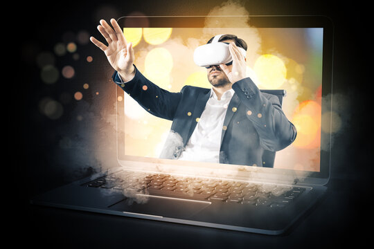 Abstract image of young caucasian businessman with VR glasses stepping out of blurry bokeh laptop screen on dark background. Metaverse, ai, virtual reality concept.