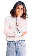 Fototapeta premium Young beautiful mixed race woman wearing casual tie dye sweatshirt thinking looking tired and bored with depression problems with crossed arms.