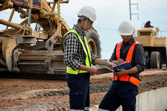 Highway engineers discuss plans for construction improvement based on roadworks. Soil Fill, Backfill Compaction for Sub base, Base Course, Surveyor Engineer inspector in highway construction.