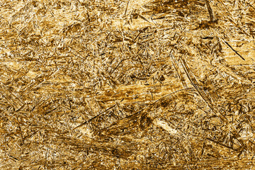 OSB board texture. Brown wooden background. Simple pressed chipboard pattern. Chip board background. Brown wood texture.