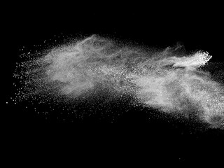 Dry white powder explosion on black background
