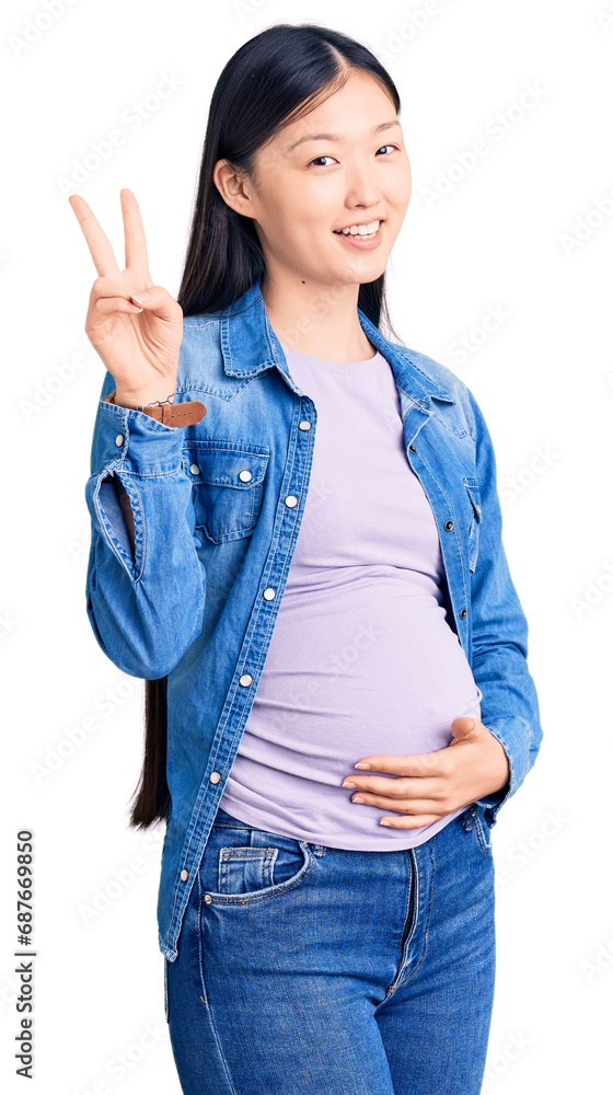 Sticker young beautiful chinese woman pregnant expecting baby smiling with happy face winking at the camera 