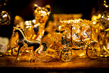 Gilded carriage jewelry in a jewelry store