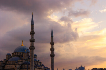 Mosque background photo. Eminonu New Mosque or Yeni Cami at sunset
