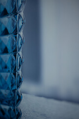 Fragment of blue corrugated glass block.Design element. Image for layout, postcard background.