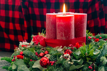 christmas candle and poinsettia