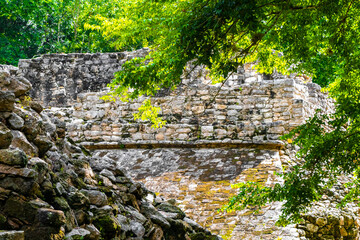 Coba Maya Ruins ancient buildings pyramids in tropical jungle Mexico.