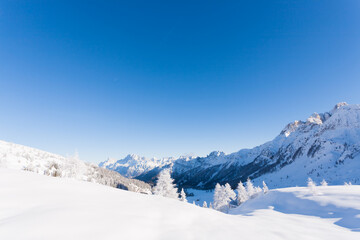 Fototapeta na wymiar Snowy alpine landscape. Italian alps winter panorama