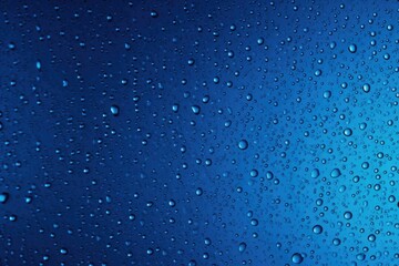 Water droplets on a blue surface. Can be used for backgrounds or textures