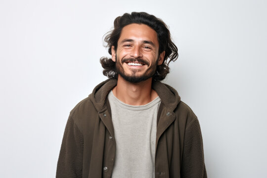 Man with long hair and beard smiling. Versatile image suitable for various uses.