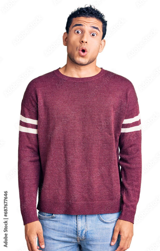 Canvas Prints Hispanic handsome young man wearing casual clothes afraid and shocked with surprise expression, fear and excited face.