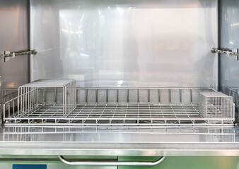 close up stainless wire rack for support utensil or other in the dishwasher machine cabinet for...