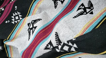 Colorful textile blanket with native thunderbird patterns