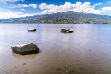 Fototapeta na wymiar Beautiful lagoon near a city, Ecuador's Lake San Pablo