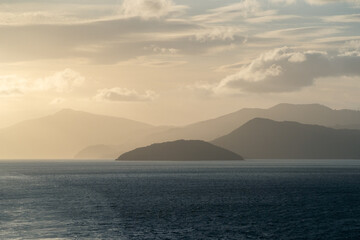 Sunset landscape of mountains and ocean