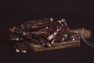 pieces of chocolate closeup, background with chocolate