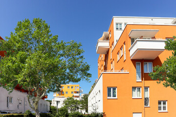 Fototapeta na wymiar Residential area with ecological and sustainable green residential buildings, low-energy houses with apartments and green courtyard