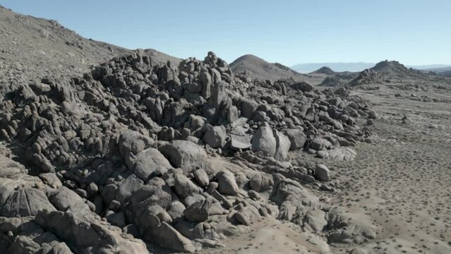 Alabama Hills Sierra Nevada California. Rock formation with snowed mountains