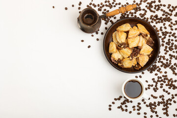 Homemade cookies and coffee on a white tablecloth