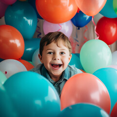 Fototapeta na wymiar Happy child surrounded by balloons.