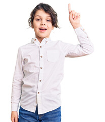 Cute hispanic child wearing casual clothes pointing finger up with successful idea. exited and happy. number one.