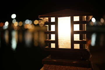 Lanterns illuminate the park at night.
