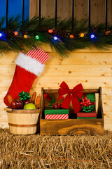 Equine Christmas, Christmas presents in a groom's tote, a basket full of horse treats along with a Christmas Stocking hanging outside a stall