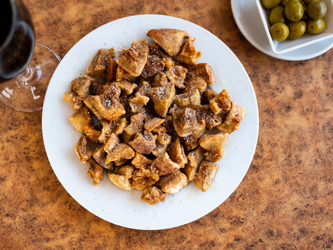 Morros fritos - traditional Spanish meat appetizer served on a plate